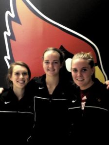 Kristen Kitrick [from left], a Wall graduate and student assistant at Catholic University, and Brigid Gannon, a Manasquan graduate, and Mary Hagaman, a St Rose graduate, both players, have all played key roles in the success of the Cardinals’ basketball program. Photo courtesy ROBIN GANNON